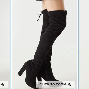 Thigh high black boots